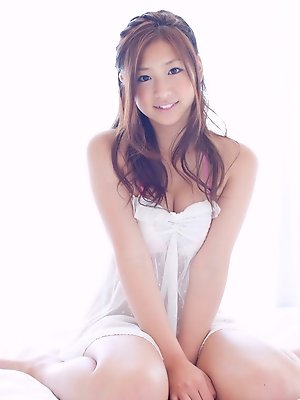 Ayaka Sayama Asian smiles while revealing curves in red lingerie