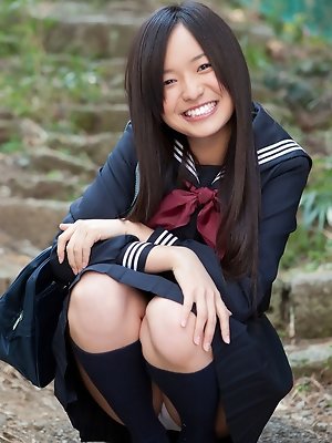 Mayumi Yamanaka Asian takes a walk in her city after classes